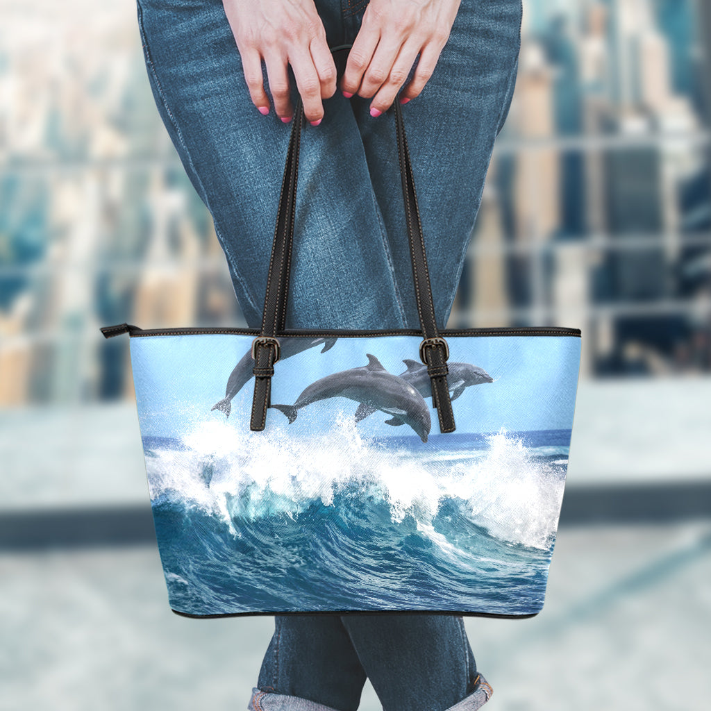 Dolphins Jumping Over Waves Print Leather Tote Bag