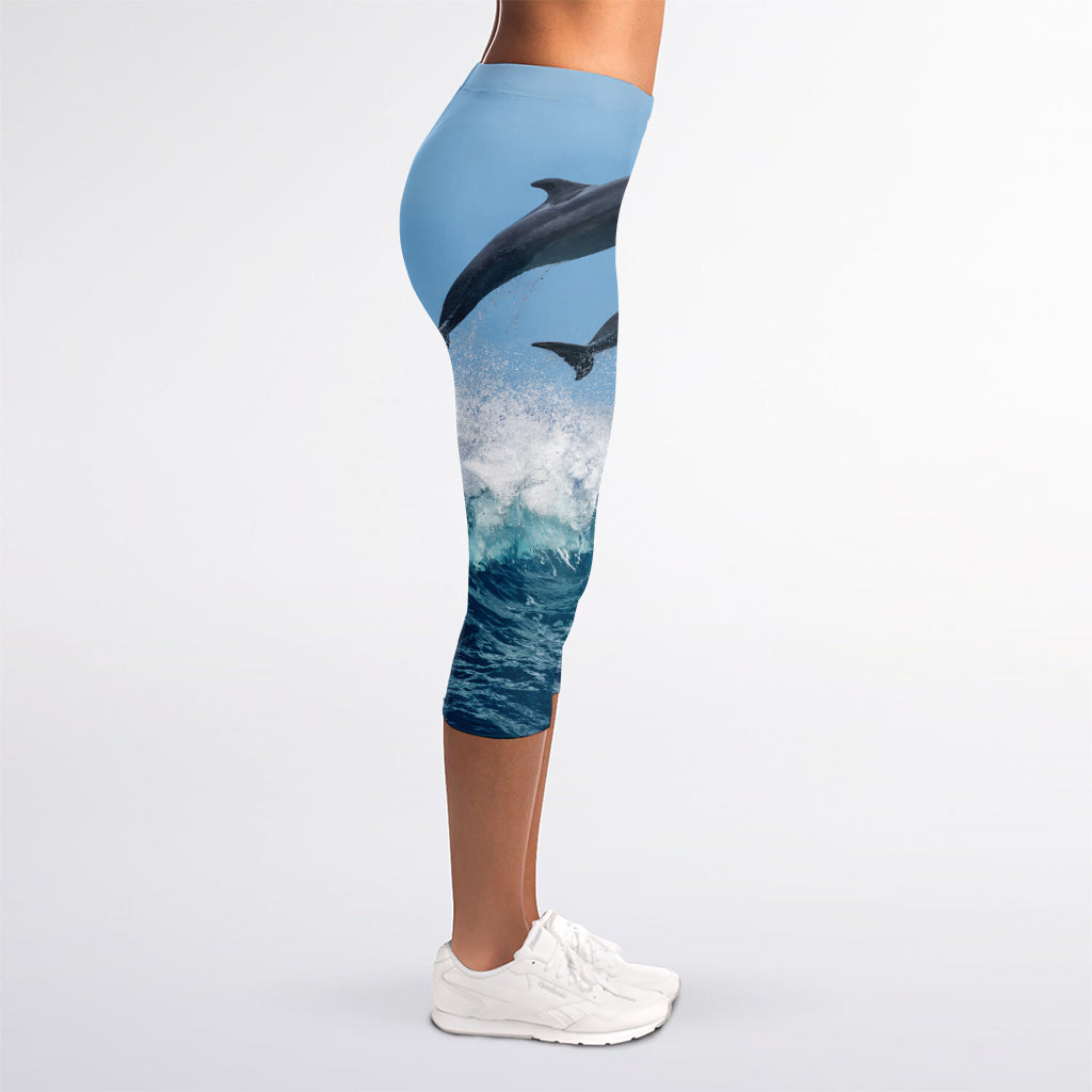 Dolphins Jumping Over Waves Print Women's Capri Leggings