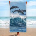 Dolphins Jumping Over Waves Print Beach Towel