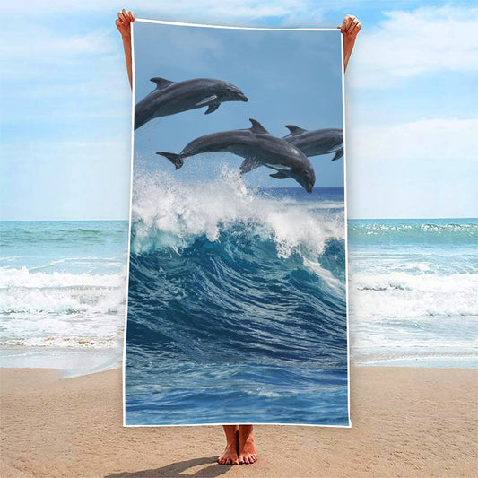 Dolphins Jumping Over Waves Print Beach Towel