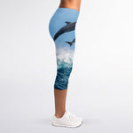 Dolphins Jumping Over Waves Print Women's Capri Leggings