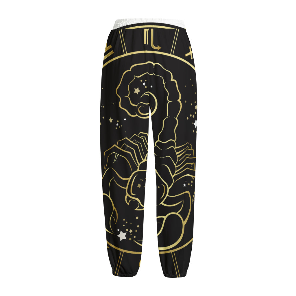 Gold And Black Scorpio Sign Print Fleece Lined Knit Pants
