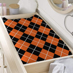 Orange And Black Argyle Print Changing Pad Cover