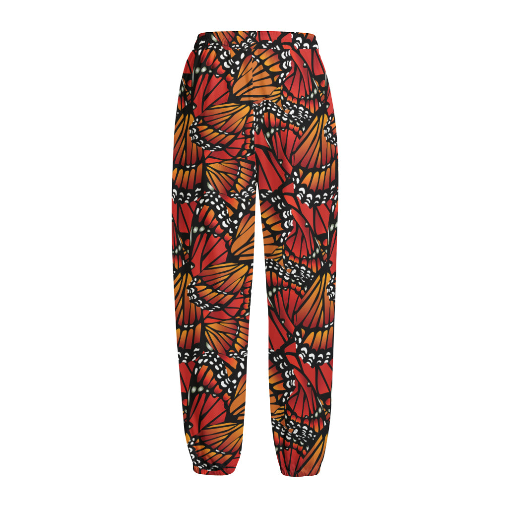 Orange Monarch Butterfly Wings Print Fleece Lined Knit Pants