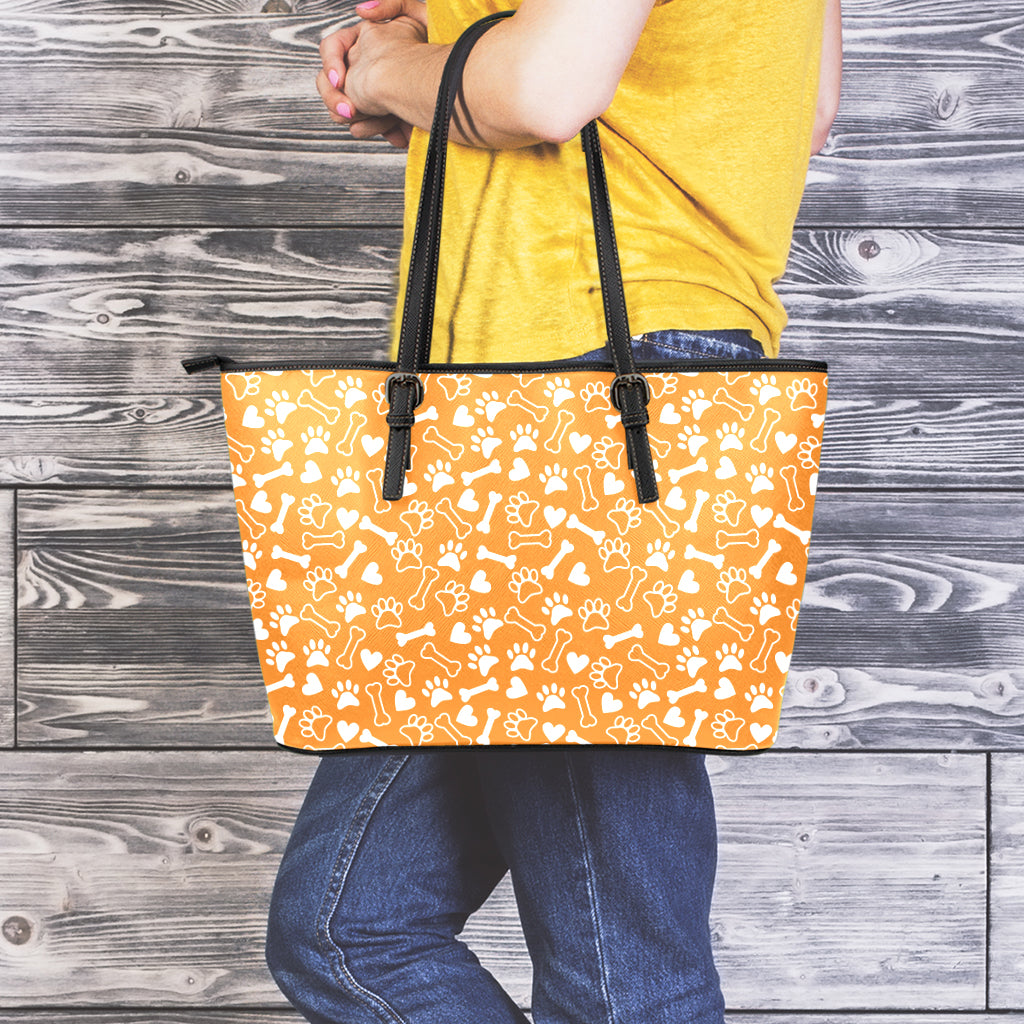 Orange Paw And Bone Pattern Print Leather Tote Bag