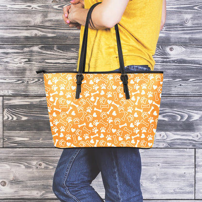 Orange Paw And Bone Pattern Print Leather Tote Bag