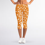 Orange Paw And Bone Pattern Print Women's Capri Leggings