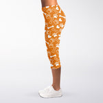 Orange Paw And Bone Pattern Print Women's Capri Leggings