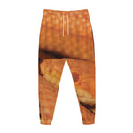 Orange Snake Print Jogger Pants
