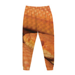 Orange Snake Print Jogger Pants