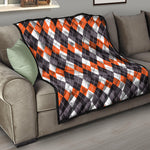 Grey Black Orange And White Argyle Print Quilt